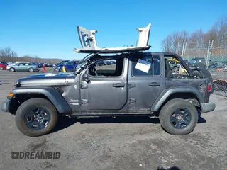 2019 Jeep Wrangler Unlimited Sport S with VIN 1C4HJXDG7KW572294, listed as a IAAI auction lot 41607986 with 61,734 mi miles and . Bid and sale history available at DreamBid. Image 6.