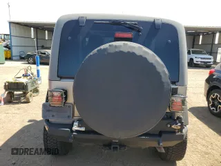 2004 Jeep Wrangler Rubicon with VIN 1J4FA69S64P751349, listed as a Copart auction lot 69642624 with 160,589 mi miles and Salvage Title. Bid and sale history available at carsss.com. Image 6.
