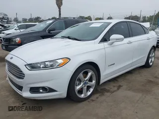 2014 Ford Fusion SE Hybrid with VIN 3FA6P0LU0ER189444, listed as a IAAI auction lot 42291020 with 187,148 mi miles and . Bid and sale history available at DreamBid. Image 2.