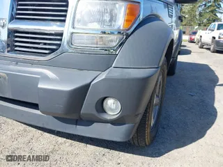 2007 Dodge Nitro SXT with VIN 1D8GU28K87W581969, listed as a IAAI auction lot 42036088 with 128,382 mi miles. Bid and sale history available at carsss.com. Image 6.