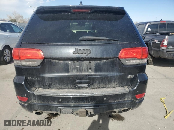 2014 Jeep Grand Cherokee Overland with VIN 1C4RJFCT2EC106002, listed as a Copart auction lot 48763675 with 143,011 mi miles and Salvage Title. Bid and sale history available at DreamBid. Image 6.