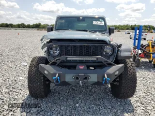 2024 Jeep Wrangler Sport S with VIN 1C4PJXDG3RW229567, listed as a Copart auction lot 55307335 with 7,797 mi miles and Salvage Title. Bid and sale history available at DreamBid. Image 5.