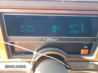 1988 Cadillac Eldorado z VIN 1G6EL115XJU611177, wystawiony jako Copart lot #46526855 z przebiegiem 122 780 mil mil oraz Szkody całkowita. Historia ofert i sprzedaży dostępna na DreamBid. Obrazek 9.