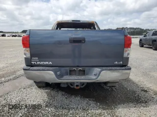 2010 Toyota Tundra с VIN 5TFUM5F15AX005061, выставлен на аукционе Copart как лот 51823565 с пробегом Не указан миль и Списание • Salvage title. История ставок и продаж доступна на DreamBid. Изображение 6.