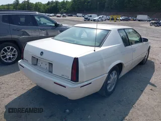 2000 Cadillac Eldorado Touring ETC z VIN 1G6ET129XYU162451, wystawiony jako IAAI lot #42412406 z przebiegiem 89 413 mil mil oraz . Historia ofert i sprzedaży dostępna na DreamBid. Obrazek 4.