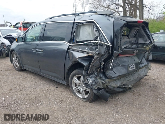 2012 Honda Odyssey Touring with VIN 5FNRL5H99CB028304, listed as a IAAI auction lot 42031916 with 216,185 mi miles and . Bid and sale history available at DreamBid. Image 3.
