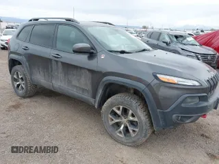 2015 Jeep Cherokee Trailhawk z VIN 1C4PJMBS7FW785575, wystawiony jako IAAI lot #41876544 z przebiegiem Nie podano mil oraz . Historia ofert i sprzedaży dostępna na DreamBid. Obrazek 1.