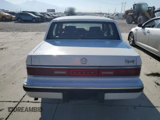 1993 Dodge Dynasty z VIN 1B3XC4632PD153627, wystawiony jako Copart lot #75645834 z przebiegiem 199 336 mil mil oraz Szkoda całkowita • Salvage title. Historia ofert i sprzedaży dostępna na DreamBid. Obrazek 6.