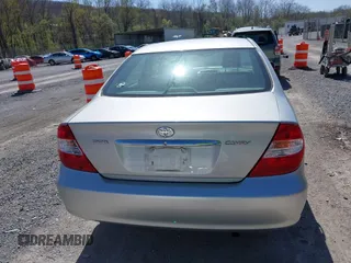 2004 Toyota Camry LE with VIN 4T1BE30K14U290983, listed as a IAAI auction lot 41983078 with 174,852 mi miles and . Bid and sale history available at carsss.com. Image 16.