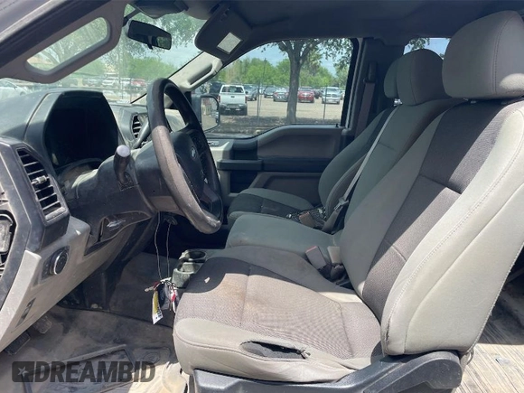 2019 Ford F-150 XL with VIN 1FTFX1E59KKE52570, listed as a IAAI auction lot 42082453 with 143,512 mi miles. Bid and sale history available at carsss.com. Image 1.