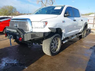 2012 Toyota Tundra 4WD Truck with VIN 5TFDW5F10CX241968, listed as a IAAI auction lot 41858300 with 272,634 mi miles. Bid and sale history available at carsss.com. Image 2.