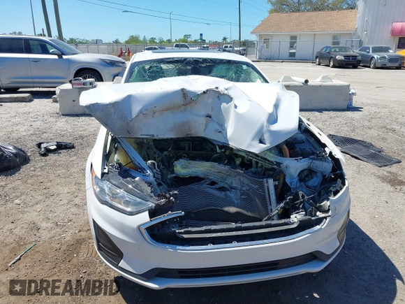 2020 Ford Fusion SE z VIN 3FA6P0LU8LR266686, wystawiony jako IAAI lot #41790126 z przebiegiem 95 314 mil mil oraz . Historia ofert i sprzedaży dostępna na DreamBid. Obrazek 6.