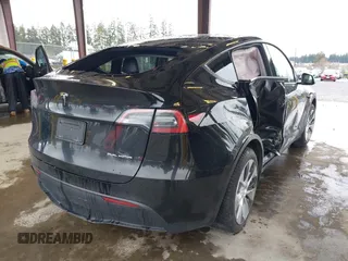 2023 Tesla Model Y Long Range with VIN 7SAYGAEE7PF739924, listed as a IAAI auction lot 41612323 with 75,226 mi miles and . Bid and sale history available at DreamBid. Image 4.