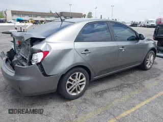 2012 Kia Forte EX with VIN KNAFU4A2XC5560585, listed as a IAAI auction lot 42121133 with 151,079 mi miles. Bid and sale history available at carsss.com. Image 4.