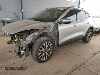 2020 Ford Escape Titanium z VIN 1FMCU9J97LUB20261, wystawiony jako Copart lot #58369545 z przebiegiem 101 717 mil mil oraz Szkody całkowita. Historia ofert i sprzedaży dostępna na DreamBid. Obrazek 1.