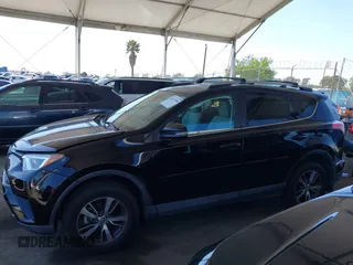 2018 Toyota RAV4 XLE with VIN 2T3WFREV2JW502622, listed as a IAAI auction lot 42327598 with 94,997 mi miles and . Bid and sale history available at DreamBid. Image 14.