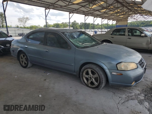 2000 Nissan Maxima GXE with VIN JN1CA31A1YT223132, listed as a Copart auction lot 60148655 with 269,258 mi miles and Salvage title. Bid and sale history available at DreamBid. Image 4.