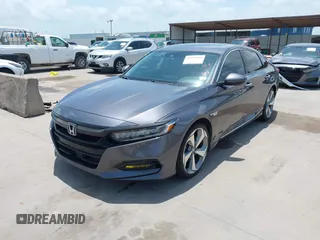 2019 Honda Accord Touring with VIN 1HGCV2F93KA013002, listed as a IAAI auction lot 42519920 with 76,841 mi miles and . Bid and sale history available at DreamBid. Image 2.