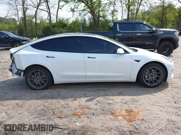 2021 Tesla Model 3 Standard Range Plus z VIN 5YJ3E1EA9MF027985, wystawiony jako IAAI lot #42045254 z przebiegiem 42 353 mil mil oraz . Historia ofert i sprzedaży dostępna na DreamBid. Obrazek 13.