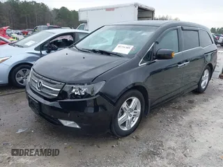 2012 Honda Odyssey Touring with VIN 5FNRL5H96CB058828, listed as a IAAI auction lot 41731389 with 152,295 mi miles and . Bid and sale history available at DreamBid. Image 18.
