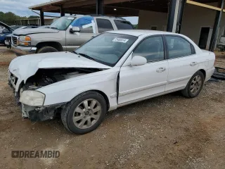 2005 Kia Optima LX z VIN KNAGD128155420451, wystawiony jako Copart lot #73483414 z przebiegiem 228 922 mil mil oraz Szkoda całkowita • Salvage title. Historia ofert i sprzedaży dostępna na DreamBid. Obrazek 1.