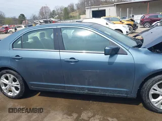 2012 Ford Fusion SE z VIN 3FAHP0HA7CR424958, wystawiony jako IAAI lot #41922636 z przebiegiem 101 149 mil mil oraz . Historia ofert i sprzedaży dostępna na DreamBid. Obrazek 14.