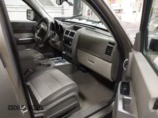 2007 Dodge Nitro SLT z VIN 1D8GU58K57W673543, wystawiony jako IAAI lot #41574634 z przebiegiem 64 286 mil mil oraz . Historia ofert i sprzedaży dostępna na DreamBid. Obrazek 5.
