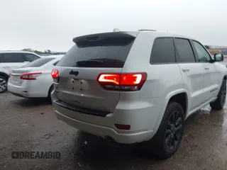 2018 Jeep Grand Cherokee Altitude with VIN 1C4RJFAG4JC320599, listed as a IAAI auction lot 42182661 with 70,957 mi miles and . Bid and sale history available at DreamBid. Image 4.