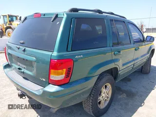 1999 Jeep Grand Cherokee Limited with VIN 1J4GW68N5XC666564, listed as a IAAI auction lot 42117018 with 177,440 mi miles. Bid and sale history available at carsss.com. Image 4.
