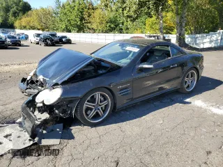 2005 Mercedes-Benz SL 55 AMG with VIN WDBSK74F05F100242, listed as a Copart auction lot 74616454 with 88,493 mi miles and Salvage title. Bid and sale history available at DreamBid. Image 1.