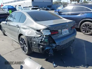 2022 BMW 5 Series M550i xDrive with VIN WBA13BK02NCJ61943, listed as a IAAI auction lot 41607980 with Not provided miles and . Bid and sale history available at DreamBid. Image 3.