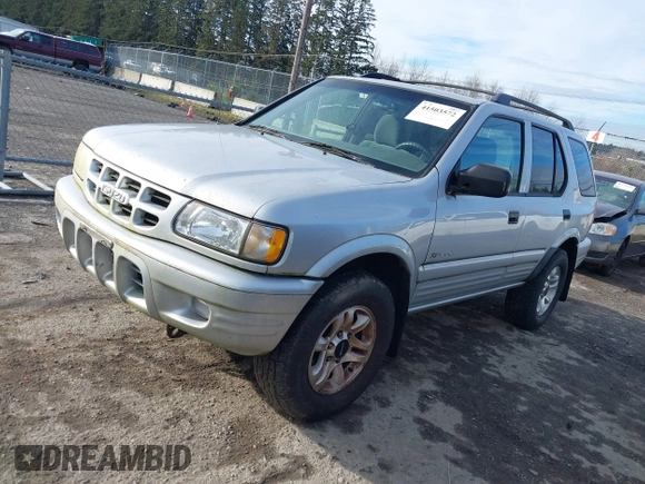 2002 Isuzu Rodeo z VIN 4S2DM58W924321403, wystawiony jako IAAI lot #41503572 z przebiegiem 235 072 mil mil oraz . Historia ofert i sprzedaży dostępna na DreamBid. Obrazek 2.