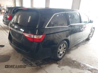 2012 Honda Odyssey EX z VIN 5FNRL5H4XCB017557, wystawiony jako IAAI lot #42367322 z przebiegiem 209 630 mil mil oraz . Historia ofert i sprzedaży dostępna na DreamBid. Obrazek 4.