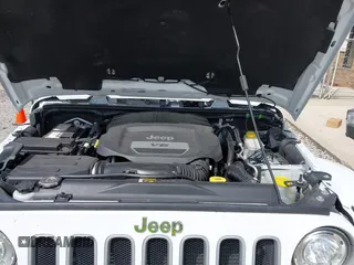 2017 Jeep Wrangler Unlimited Sahara with VIN 1C4BJWEG8HL734572, listed as a IAAI auction lot 41863636 with 123,979 mi miles. Bid and sale history available at carsss.com. Image 10.