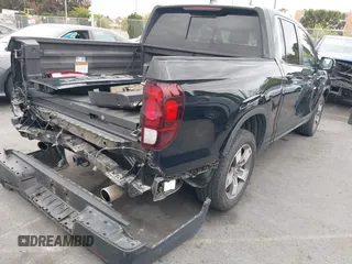 2024 Honda Ridgeline RTL with VIN 5FPYK3F56RB004027, listed as a IAAI auction lot 42049778 with 35,631 mi miles and . Bid and sale history available at DreamBid. Image 4.
