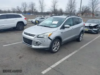 2013 Ford Escape SEL with VIN 1FMCU9HX0DUC58424, listed as a IAAI auction lot 41607775 with 120,147 mi miles. Bid and sale history available at carsss.com. Image 2.