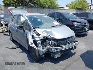 2017 Honda Fit LX z VIN JHMGK5H57HS020752, wystawiony jako IAAI lot #42050330 z przebiegiem 101 320 mil mil oraz . Historia ofert i sprzedaży dostępna na DreamBid. Obrazek 1.