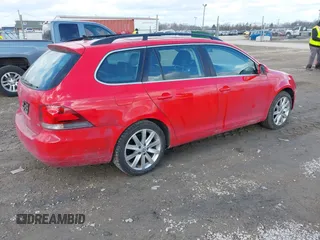 2012 Volkswagen Jetta SportWagen TDI with VIN 3VWPL7AJ0CM684682, listed as a IAAI auction lot 41680632 with 124,721 mi miles. Bid and sale history available at carsss.com. Image 4.
