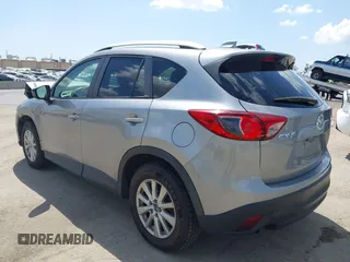 2014 Mazda CX-5 Touring z VIN JM3KE2CYXE0322943, wystawiony jako IAAI lot #41934670 z przebiegiem 110 690 mil mil oraz . Historia ofert i sprzedaży dostępna na DreamBid. Obrazek 3.