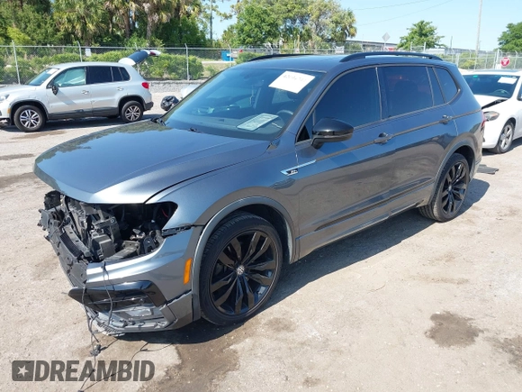 2020 Volkswagen Tiguan SE with VIN 3VV3B7AX3LM176300, listed as a IAAI auction lot 42004744 with 86,074 mi miles and . Bid and sale history available at DreamBid. Image 2.