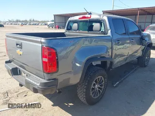 2018 Chevrolet Colorado 4WD ZR2 z VIN 1GCGTEEN0J1115894, wystawiony jako IAAI lot #41774860 z przebiegiem 71 698 mil mil oraz . Historia ofert i sprzedaży dostępna na DreamBid. Obrazek 4.