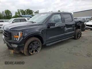2023 Ford F-150 XL with VIN 1FTFW1E52PFC97105, listed as a Copart auction lot 62115825 with 27,400 mi miles and Salvage title. Bid and sale history available at DreamBid. Image 1.