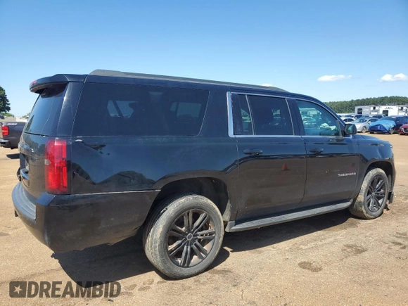 2019 Chevrolet Suburban LS with VIN 1GNSCGECXKR208615, listed as a Copart auction lot 52187105 with 174,105 mi miles and Salvage title. Bid and sale history available at DreamBid. Image 3.