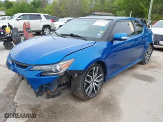 2014 Scion tC with VIN JTKJF5C77E3081277, listed as a IAAI auction lot 41932581 with 135,556 mi miles. Bid and sale history available at carsss.com. Image 2.