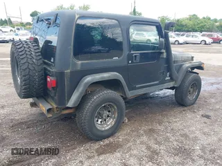 2004 Jeep Wrangler Sport z VIN 1J4FA49S94P792689, wystawiony jako IAAI lot #42394196 z przebiegiem Nie podano mil oraz . Historia ofert i sprzedaży dostępna na DreamBid. Obrazek 4.