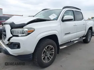 2016 Toyota Tacoma SR5 z VIN 5TFAZ5CN5GX018977, wystawiony jako IAAI lot #42303122 z przebiegiem 99 545 mil mil oraz . Historia ofert i sprzedaży dostępna na DreamBid. Obrazek 2.
