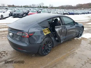 2023 Tesla Model 3 Performance with VIN 5YJ3E1EC6PF590739, listed as a IAAI auction lot 40919165 with 20,474 mi miles. Bid and sale history available at carsss.com. Image 4.