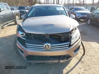2016 Volkswagen Touareg Sport with VIN WVGEF9BP0GD003241, listed as a IAAI auction lot 41498797 with 90,141 mi miles and . Bid and sale history available at DreamBid. Image 6.