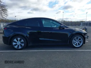 2022 Tesla Model Y Long Range with VIN 7SAYGAEE4NF522330, listed as a IAAI auction lot 42046691 with 59,980 mi miles and . Bid and sale history available at carsss.com. Image 12.