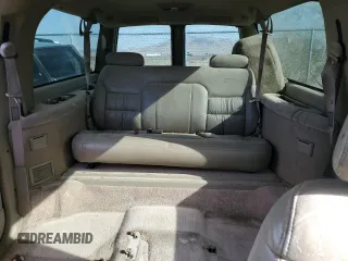 1997 GMC Suburban z VIN 3GKGK26J0VG522963, wystawiony jako Copart lot #56804105 z przebiegiem 297 544 mil mil oraz Tytuł czysty. Historia ofert i sprzedaży dostępna na DreamBid. Obrazek 10.